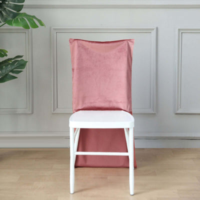 Pink chair cover draped over a white chair against a neutral background.
