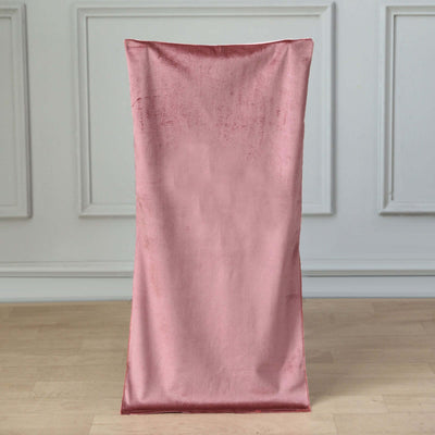 Pink velvet chair cover on a plain backdrop