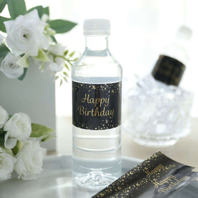 Birthday-themed water bottle with black and gold label.