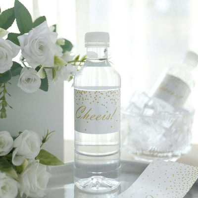 Water bottle with "Cheers!" label, surrounded by flowers and decorative elements.