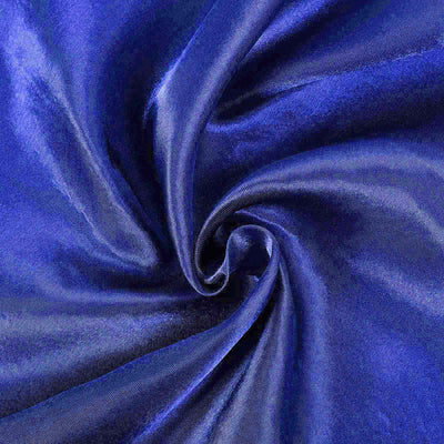 Deep royal blue satin fabric swirled in a circular pattern.