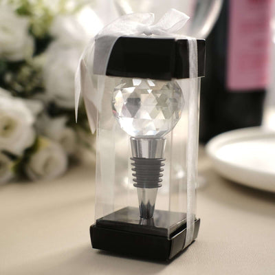 Crystal wine stopper in elegant gift packaging with ribbon.