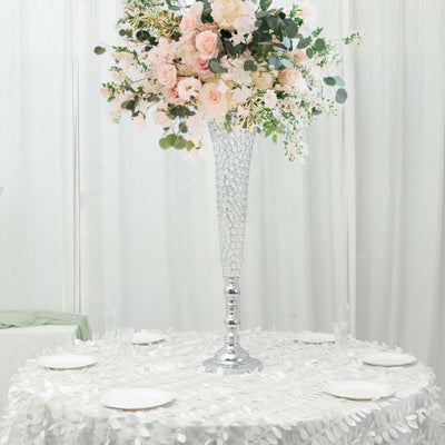 Elegant floral centerpiece in a crystal vase for wedding or event decor.
