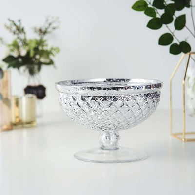 Decorative crystal bowl with a textured pattern and elegant pedestal base.