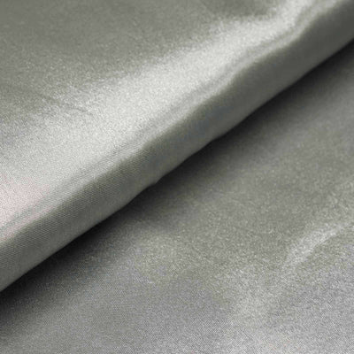 Silky grey fabric folded neatly on a surface.