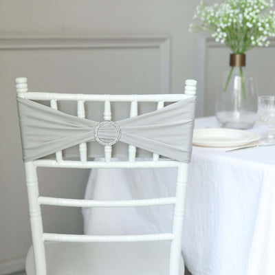 Gray chair sash with rhinestone detail on a white chiavari chair.