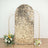 Gold sequin backdrop with floral arrangements, perfect for events and photo shoots.