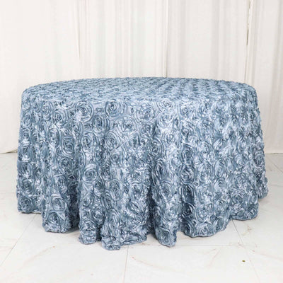 Blue rose-patterned round tablecloth on a plain background.