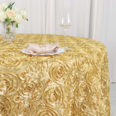 Gold rose-patterned tablecloth with elegant napkin and wine glass.