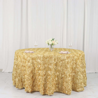 Gold rose-patterned tablecloth on a round table with floral centerpiece.