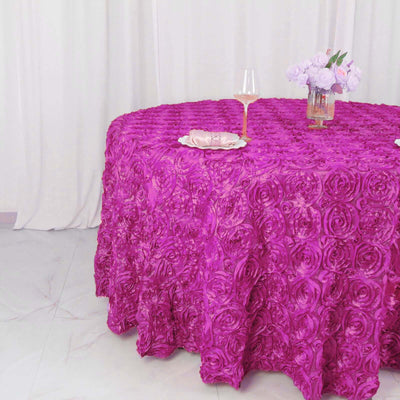 Purple rose-patterned tablecloth draping over a round table