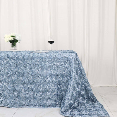 Blue rose textured tablecloth draped elegantly on a table.