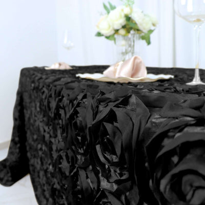 Elegant black rose tablecloth on a beautifully set dining table.