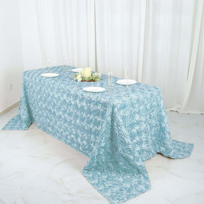 Elegant blue floral tablecloth draped over a dining table.