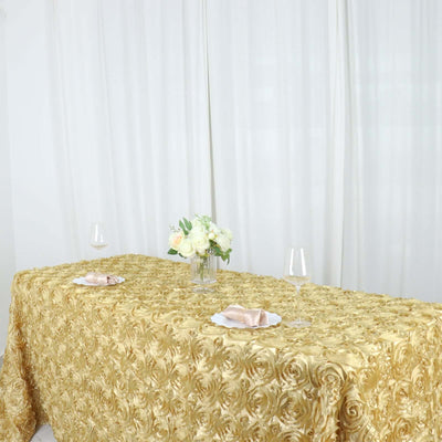 Elegant gold tablecloth with floral texture, set for a dining occasion.