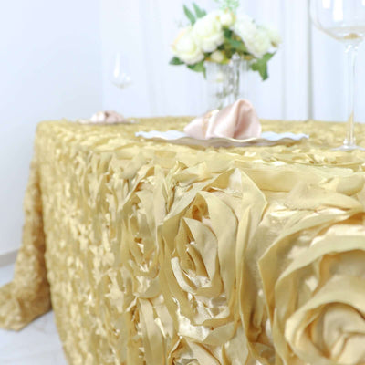 Gold rose tablecloth draping over a table with floral centerpiece and glassware.