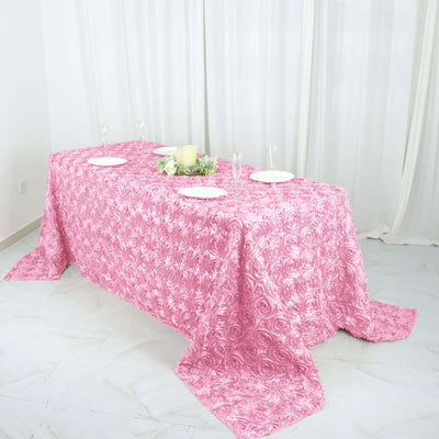 Pink rose-patterned tablecloth draped elegantly over a dining table.
