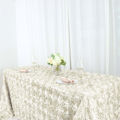 Elegant table setting with floral centerpiece and wine glasses.