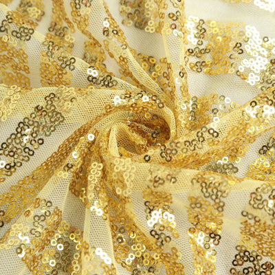 Gold sequin fabric swirled for texture and detail.