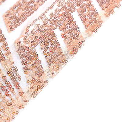 Rose gold sequin fabric with intricate pattern detail.