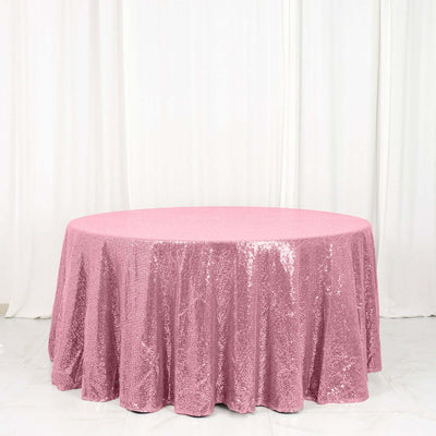 Pink sequin tablecloth draped elegantly on a round table
