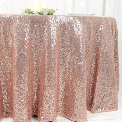 Rose gold sequin tablecloth draped elegantly on a table.