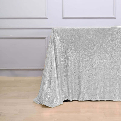 Silver sequin tablecloth draping elegantly over a table.
