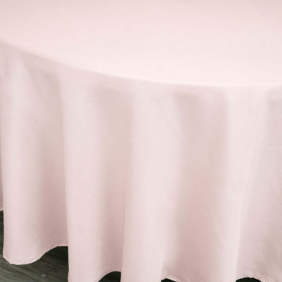 Light pink round tablecloth draped elegantly over a table.