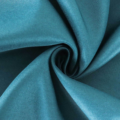 Teal fabric close-up showcasing smooth texture and rich color.