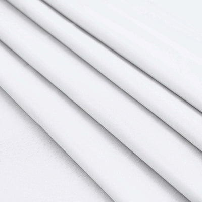 White fabric folds on a smooth surface.