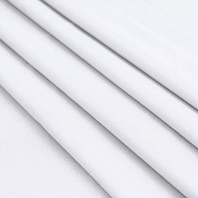 White fabric folds, showcasing smooth texture and clean lines.