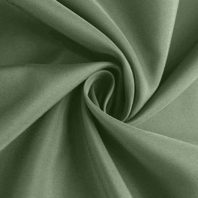 Green fabric texture with smooth, soft folds.