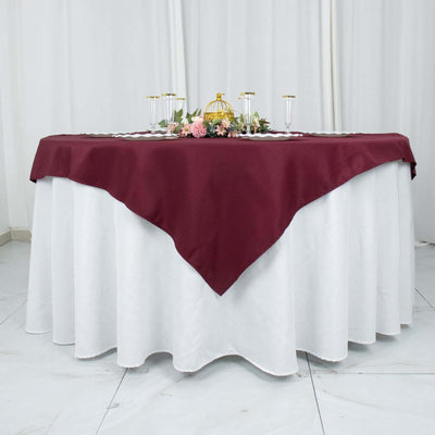 Burgundy tablecloth draped elegantly over a white table