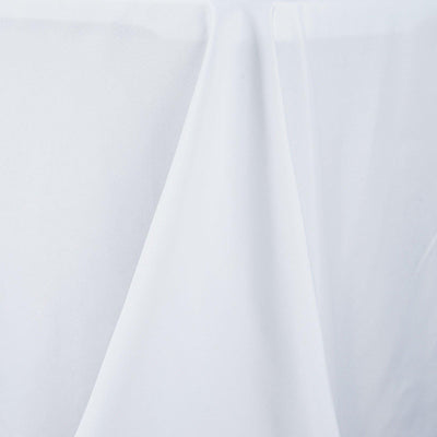 White tablecloth draped elegantly on a table surface.