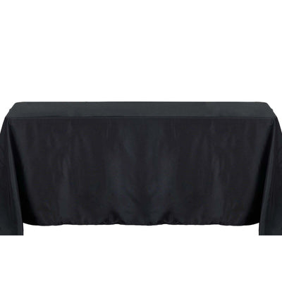Black tablecloth on a plain surface for event styling