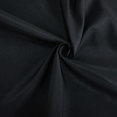 Black fabric with a smooth texture, ideal for versatile fashion and design applications.