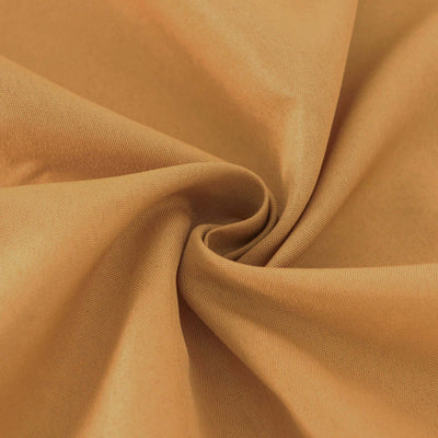 Close-up of soft, textured golden fabric.