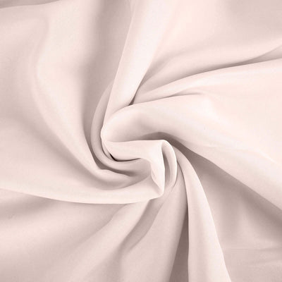 Soft, flowing fabric in a light beige hue, showcasing smooth texture.