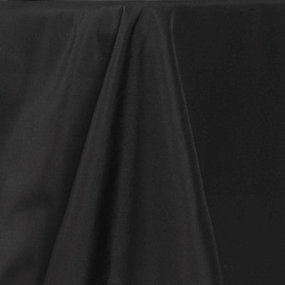 Black fabric draped elegantly on a surface.