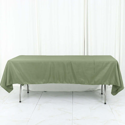 Green tablecloth draped over a table in a studio setting