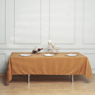 Create a Luxurious Setting with the Gold Seamless Polyester Rectangular Tablecloth 60"x102"