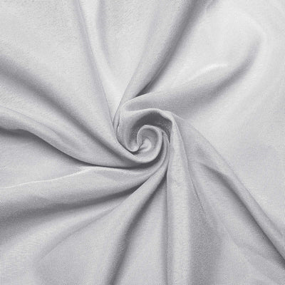 Silver fabric with a smooth texture, arranged in a spiral pattern.