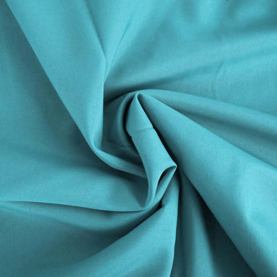 Turquoise fabric texture showcasing soft, smooth draping.