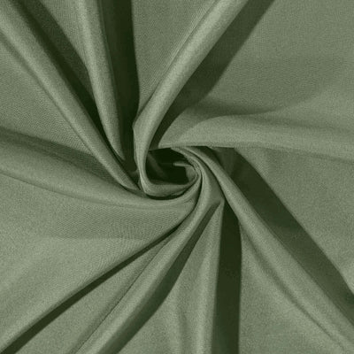 Green fabric swirl texture on a neutral background.