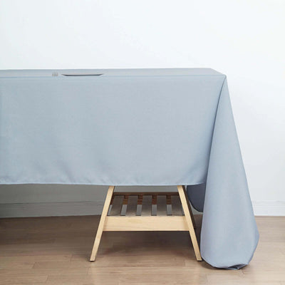 Gray tablecloth draped over a wooden table