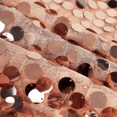 Rose gold sequin fabric with circular sequins on a soft sheer background.