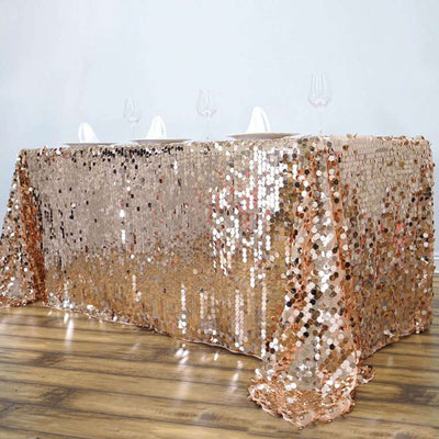 Rose gold sequin tablecloth draped elegantly over a table.