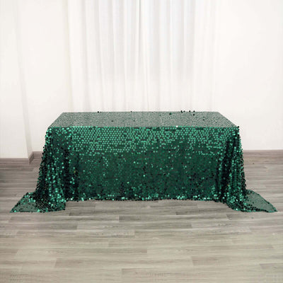 Green sequin tablecloth draped elegantly over a table.