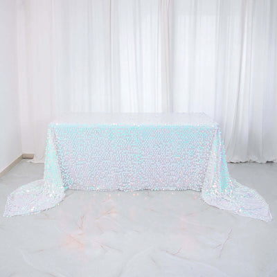 Sequin tablecloth with shimmering iridescent design on a plain backdrop.