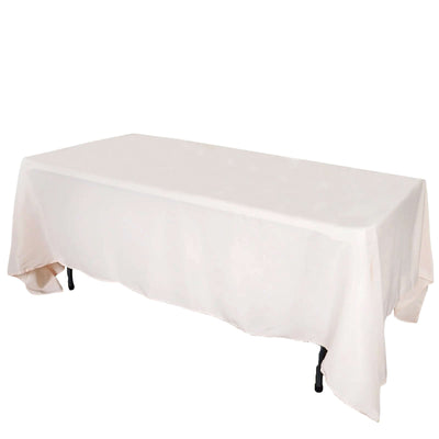 Rectangular table covered with a light beige tablecloth